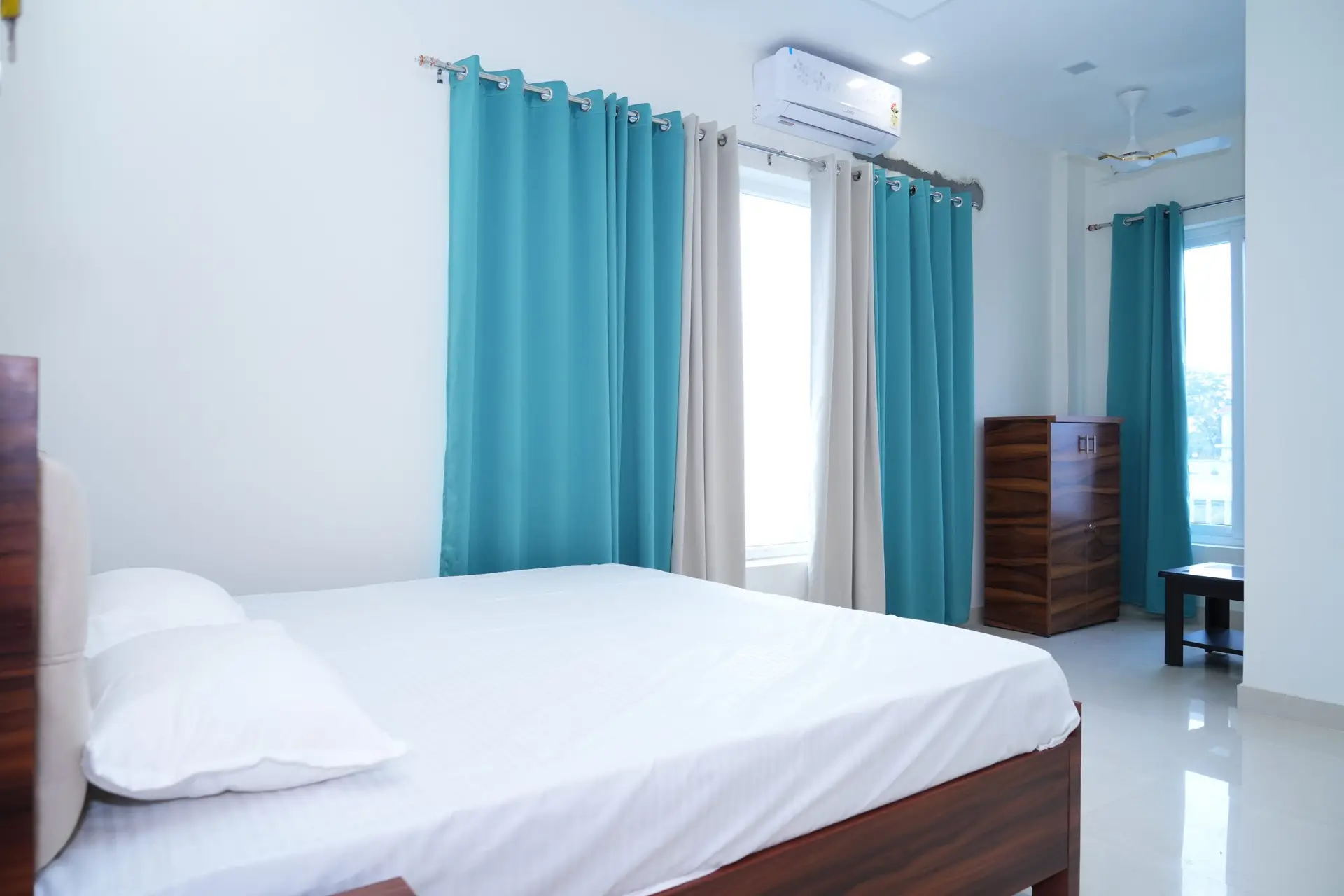 "Standard Room at Chandra Palace with king-sized bed, AC, smart TV, and modern amenities – perfect for couples or business travelers."